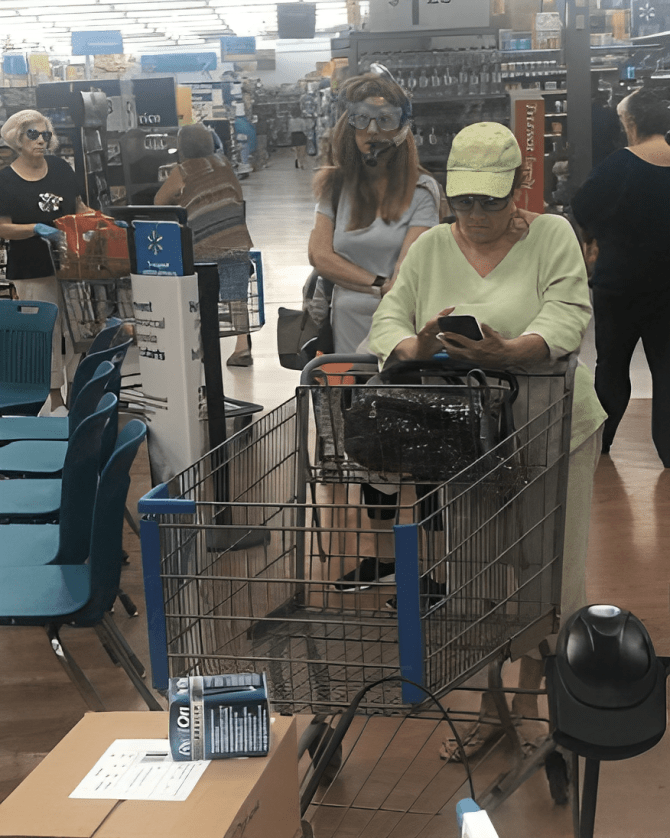 A person in a shopping cart Description automatically generated