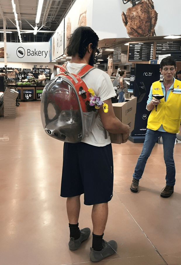 A person wearing a backpack in a store Description automatically generated